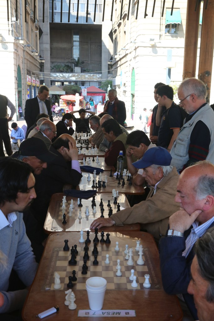 Men playing chess in Plaza de Armas